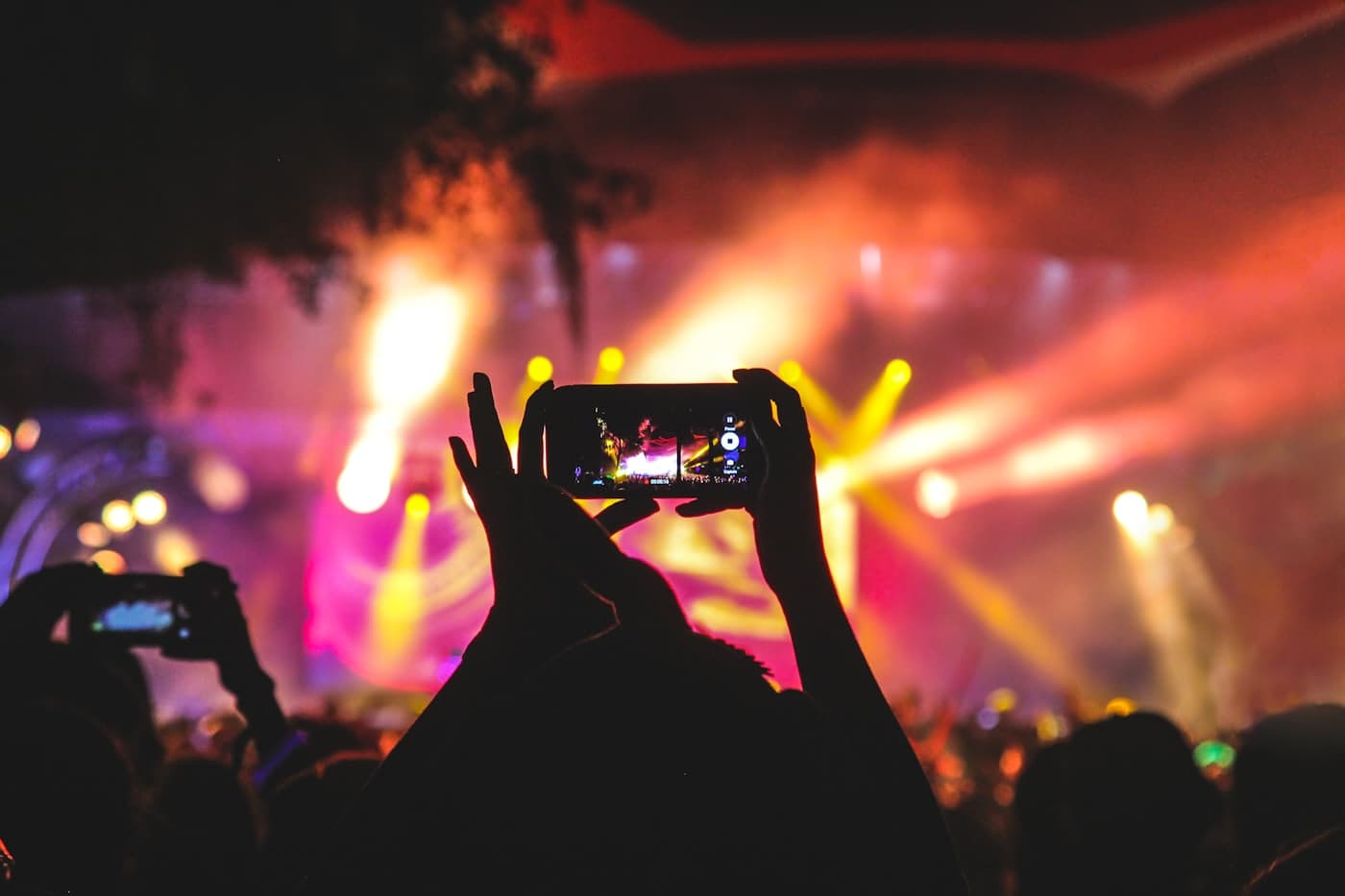 Someone filming a live crowd on a phone